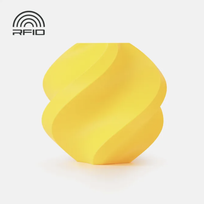Black swirled object Printed in Bambu Lab Basic PLA light yellow object with RFID logo on a light gray background